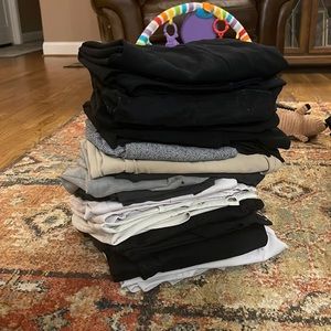 16 pairs of size 20w office trousers. All different designs.